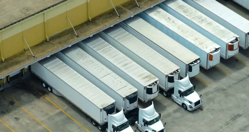 Cargo trucks loading at a distribution centre
