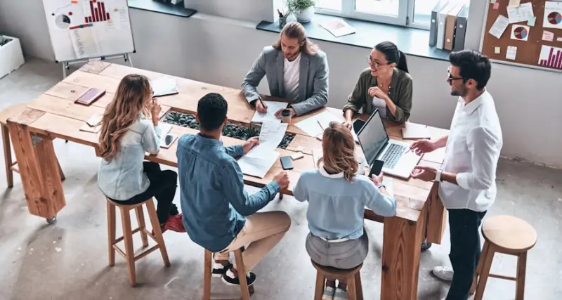 Startup team working together around a shared table
